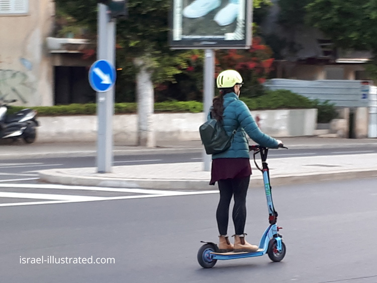 Woman riding an electric scooter